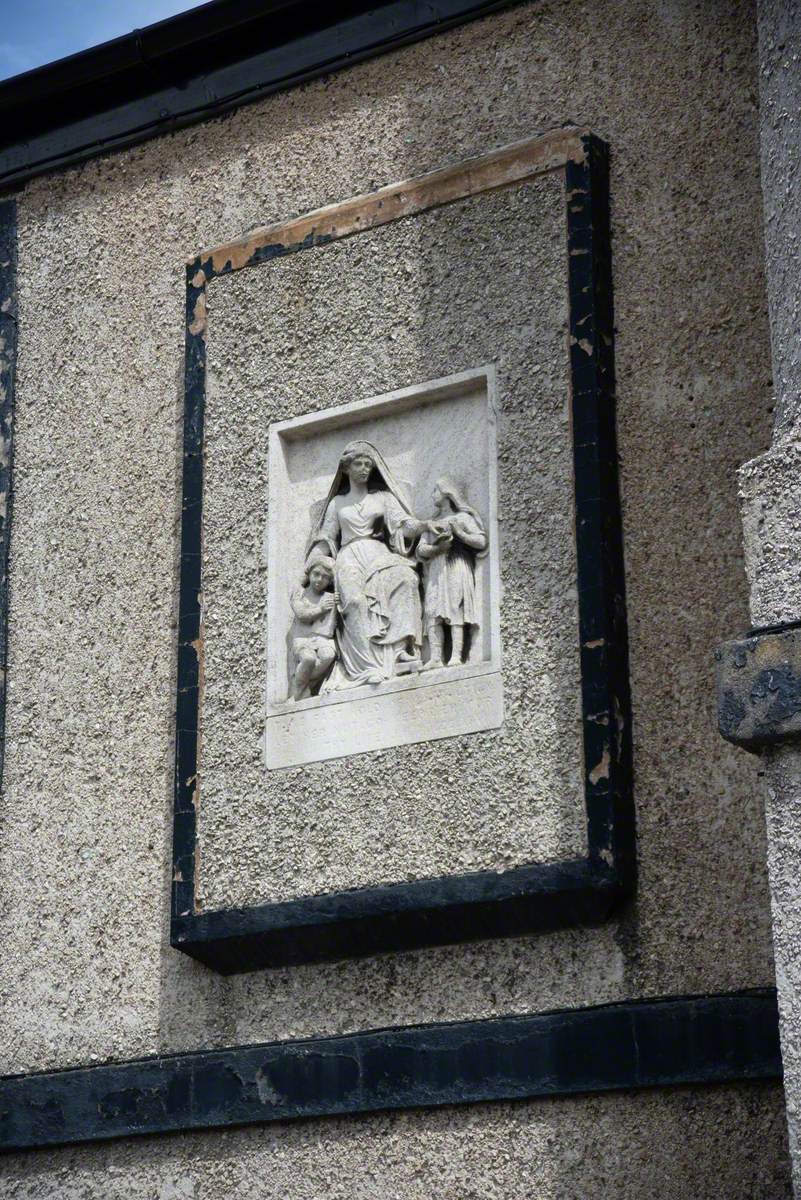 Woman Instructing Small Children and Man Teaching a Youth (Reliefs)