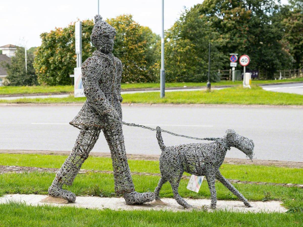 Man Walking a Dog