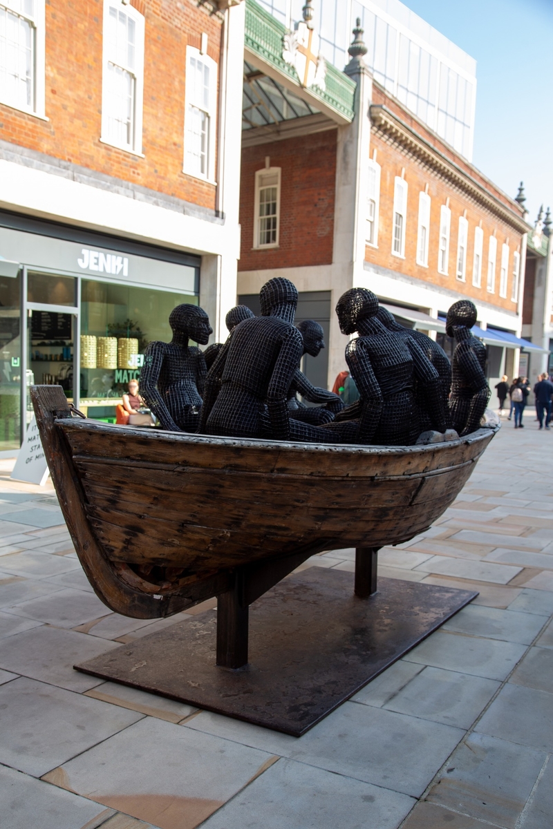 Wooden Boat with Seven People