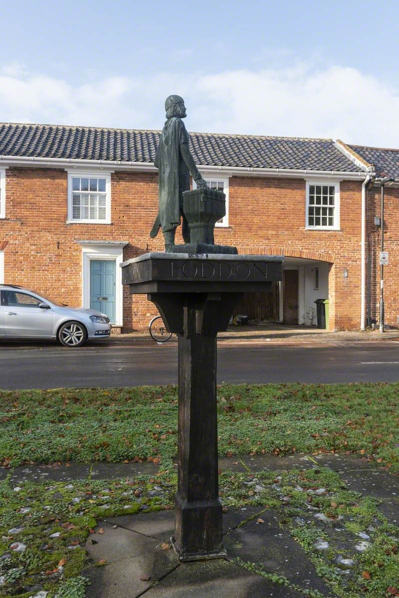 Village Sign with Statue of Aelfric Modercope