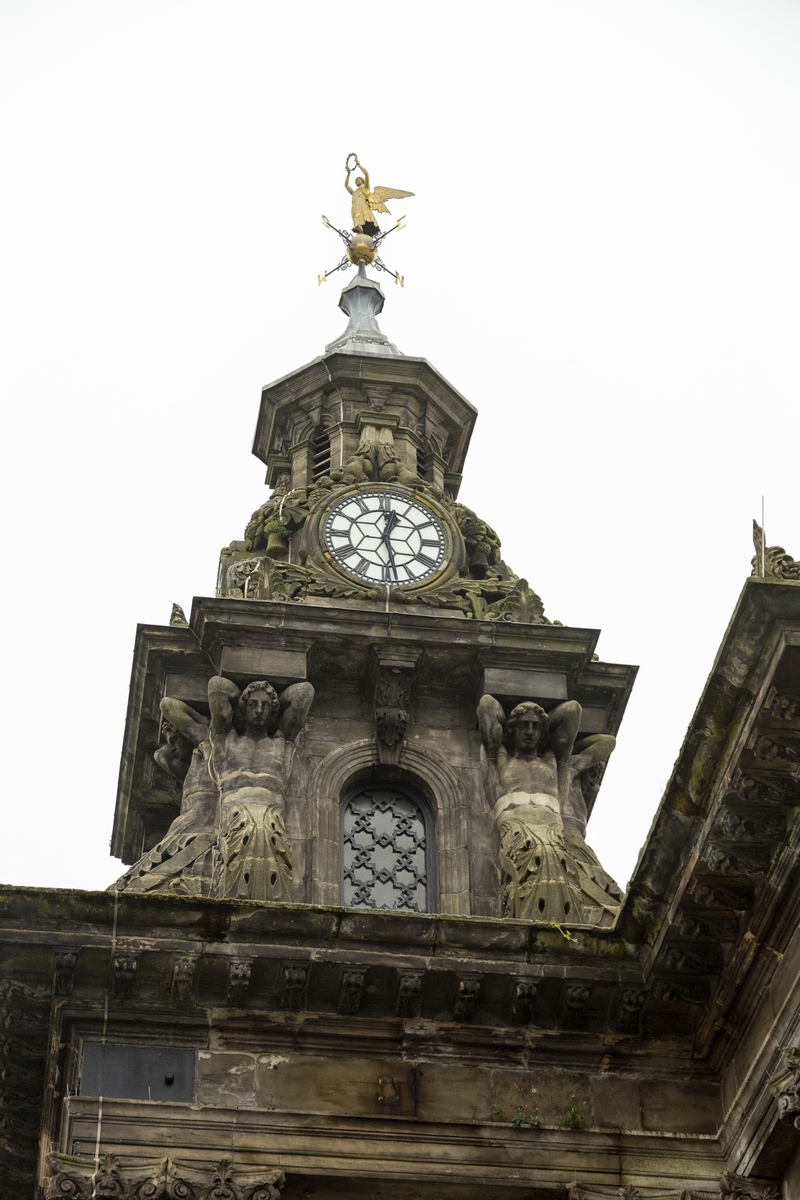 Clock Tower with Caryatids Figures