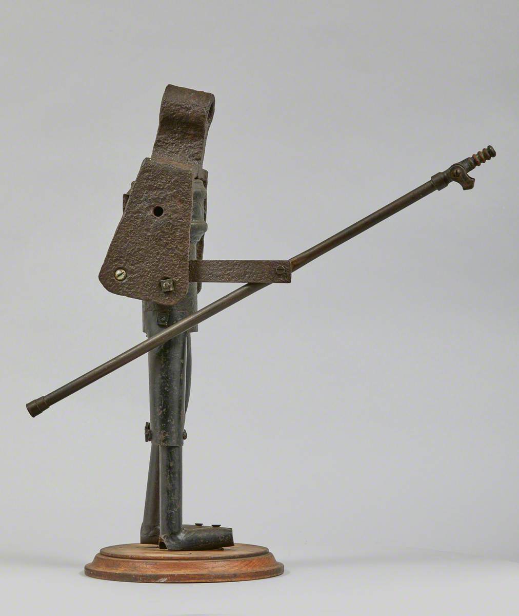 Metal Junk Sculpture: Person with Long Implement in Hand