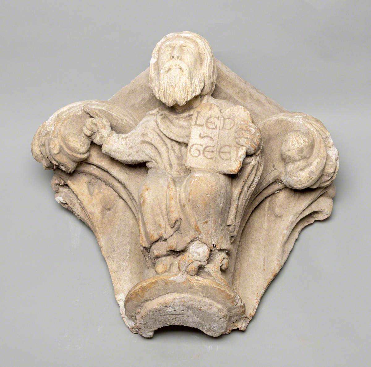 Column Capital Showing a Man Holding a Book