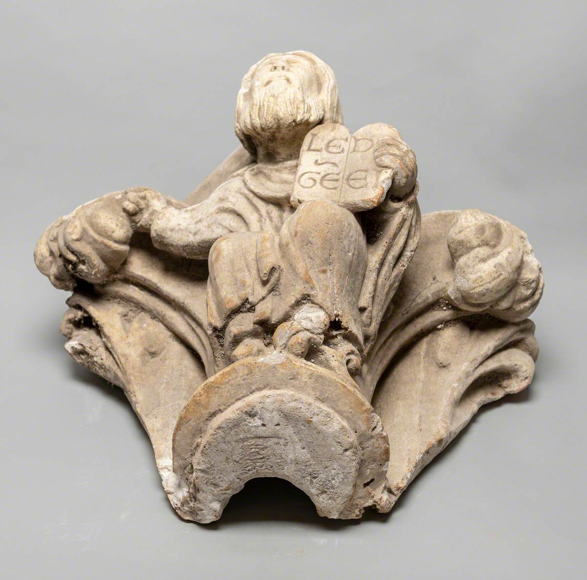 Column Capital Showing a Man Holding a Book