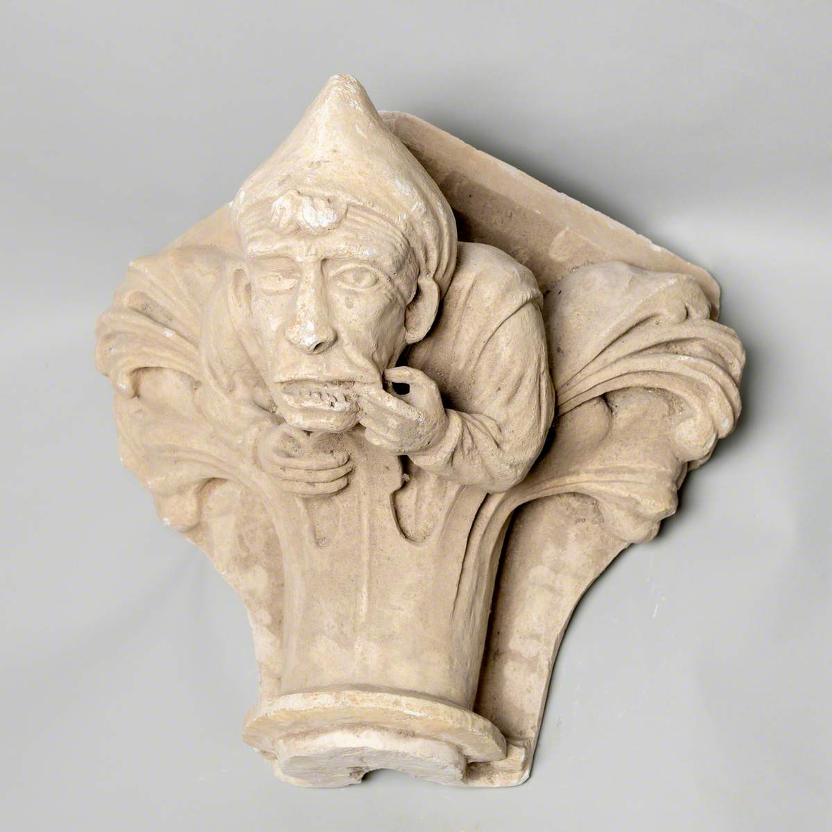 Column Capital Showing a Man Pulling a Face