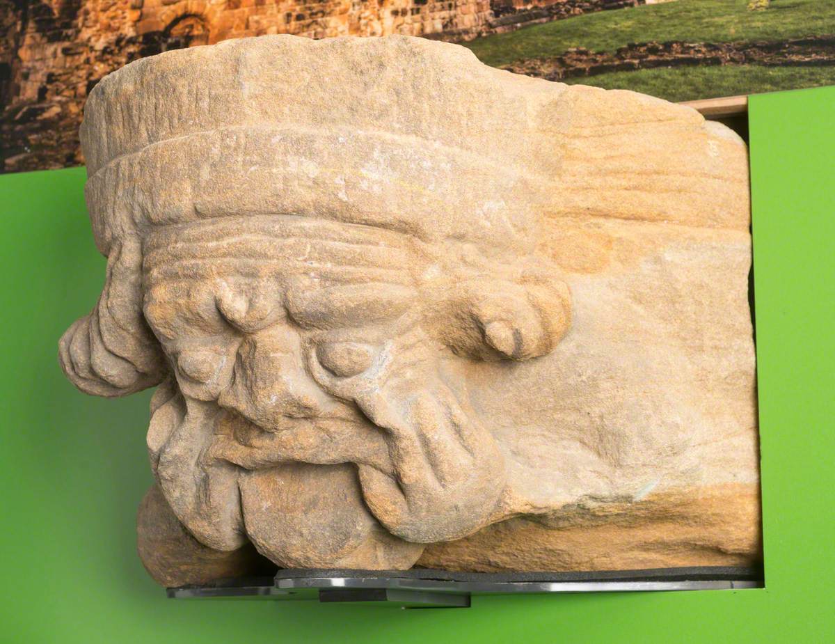 Sandstone Corbel Carved with Human Head with Fingers in the Corners of Mouth: Monk Bretton Priory