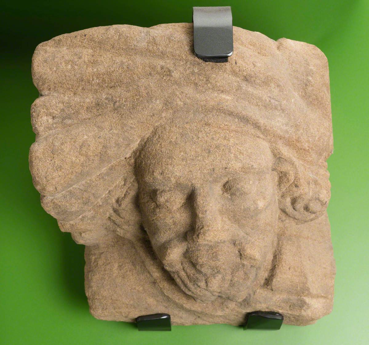 Sandstone Corbel with Realistic Male Human Head Wearing Hat or Turban: Monk Bretton Priory