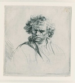 Curly-headed man with a wry mouth