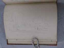 Recto: blank 
Verso: view with trees and a palace in the background