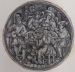 Four people at the table and a musician