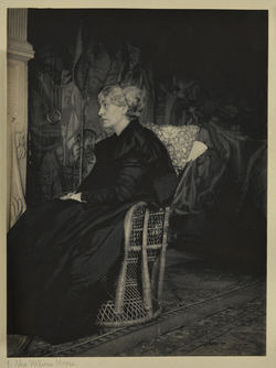 Jane Morris seated in profile in the Old Tapestry Room at Kelmscott Manor, Oxfordshire