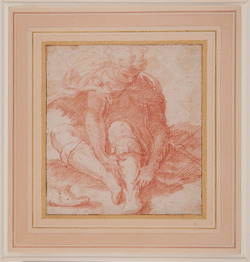 Young pilgrim seated on the ground