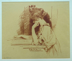 Young woman in profile sitting reading at a table
