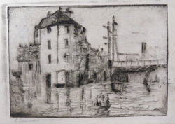 House next to a Bridge with a Boat below