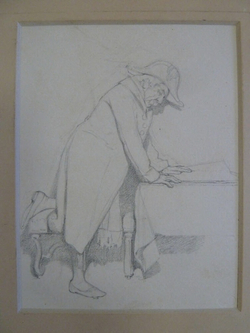 A Man leaning over a Table