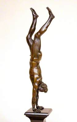 Acrobat Performing a Handstand