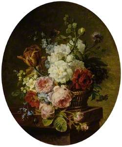 Open wicker basket of mixed flowers, including tulip, roses, harebell, hollyhock, poppy, larkspur and auricula on a marble ledge