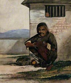 A Man of Simla Squatting in a Prison with Manacles around His Ankles