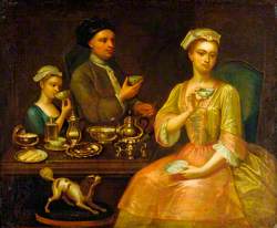 A Family of Three at Tea