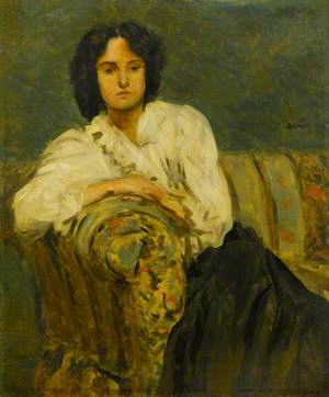 Girl in a White Blouse on a Sofa