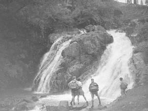 Walkers by Waterfall