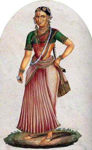 A Indian Woman Dancer Holding a Flower in One Hand