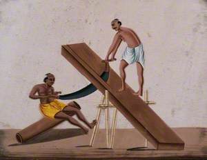 Two Men Sawing a Large Block of Wood