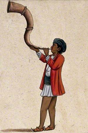 An Indian Musician Playing a Long, Inverted S-Shaped Trumpet