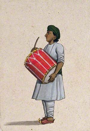 A Musician Playing a Dholka (Folk Drum)