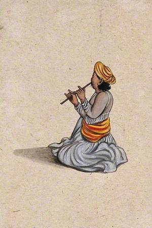 An Indian Musician Playing a Bansuri (Flute)