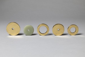 Four Brass Rings and One Jade Ring