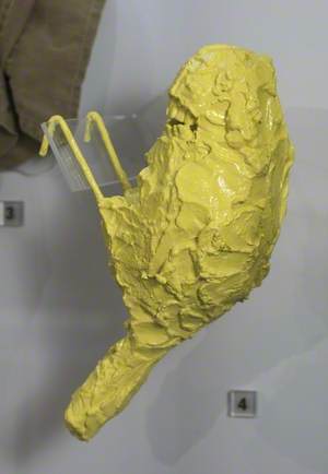 Yellow Painted Sculpture of Bird with Teeth