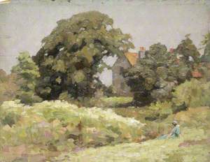 Woman in a Green Dress Sitting on the Grass