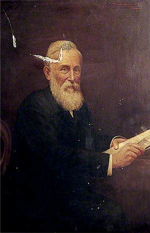 Man with White Hair and a Beard Holding Papers