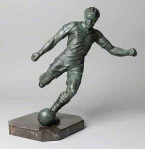 Footballer Kicking a Ball