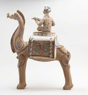 Musician Riding a Camel