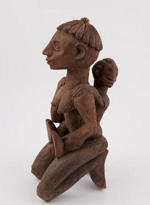 Kneeling Woman Holding Child