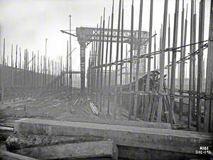 Erecting midship frames, working from stern forward. Bow view to stern