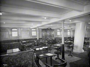 Second class library and writing room with mast passing through floor to ceiling