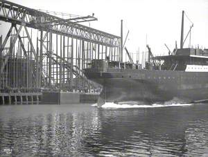Launch; starboard stern view entering water from No. 8 slip, South Yard