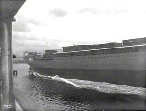 Launch; view of starboard side of hull entering water
