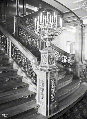 First class after main staircase, balustrade and electric candleabra