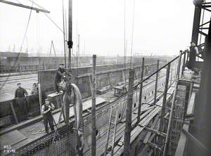 Hydraulic riveter working on topside shell plating