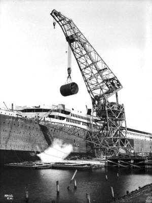 Boiler being lifted aboard by floating crane