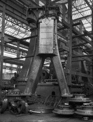 Pillar of engine being lifted in engine works for transport to ship