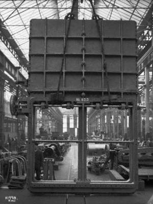 Giant sluice valve, known as a 'swiss' valve, in workshop prior to installation between the turbine exhaust opening and the condenser