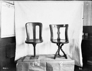 Two examples of different designs of dining saloon chairs, probably third class