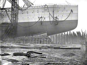 Starboard bow profile immediately prior to launch, with slung cables and anchors.
