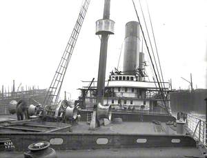 View aft from forecastle deck hatch towards bridge, with windlasses and mast in foreground