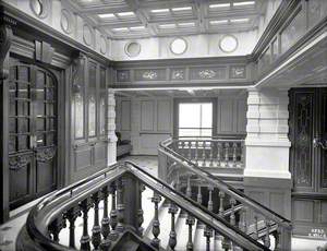 Staircase, landing and door to first class library